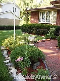 ENTRYWAY : Brick walk w/ Stone Bench (that stays)