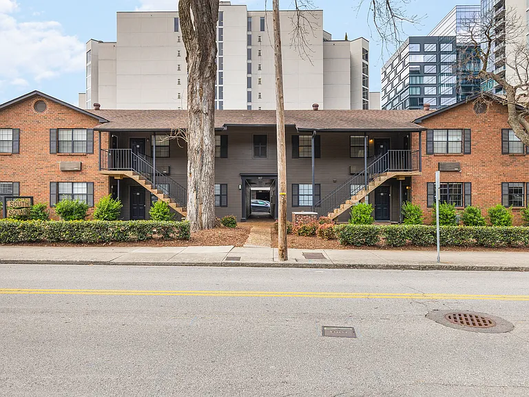 The outside of our building. 1 dedicated parking spot in the back of the building. Plenty of additional free street parking.