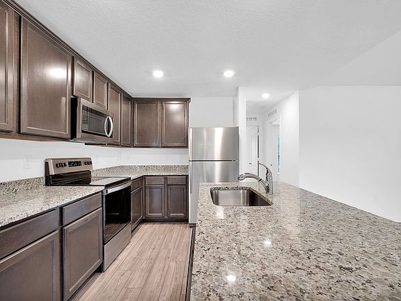 This move-in ready home features gorgeous granite countertops in the kitchen
