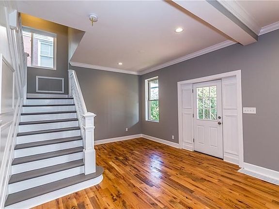 Lovely front entry way, shows off the new red oak floors - beautiful front steps.