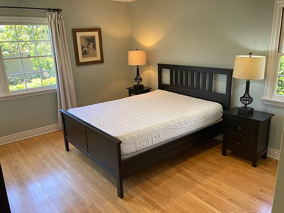 Two nightstands with lamps. Plenty of outlets.
