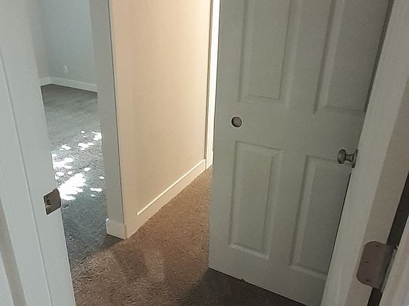 Entrance to master bedroom and view of closet.