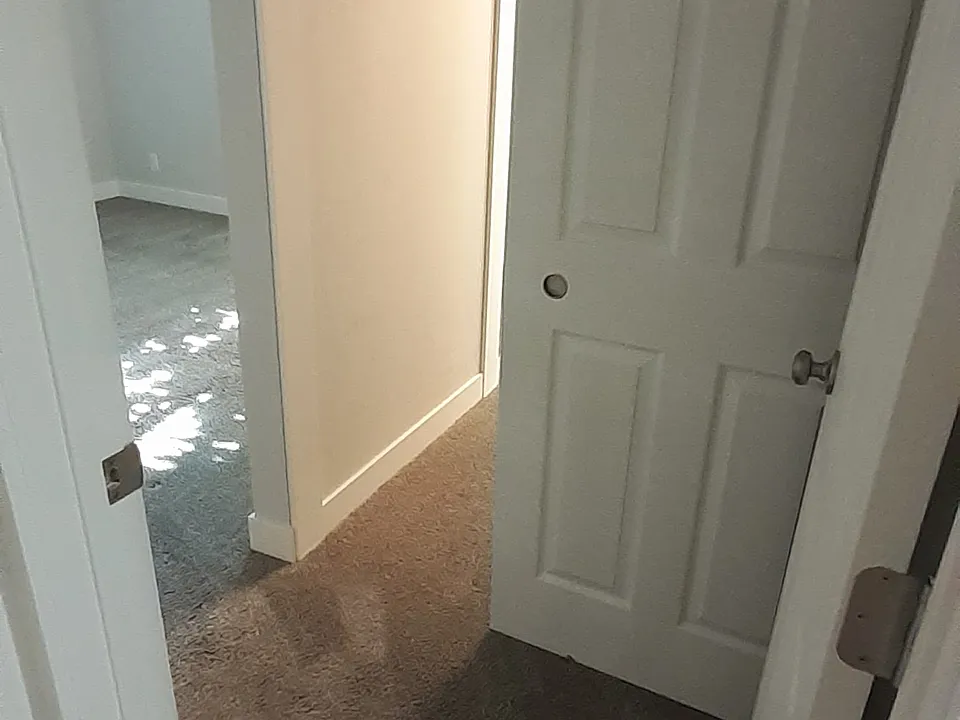 Entrance to master bedroom and view of closet.