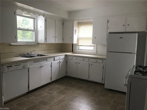 Large eat in kitchen with ample cabinets and counter space.