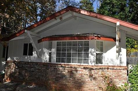 NEWER WINDOW TREATMENTS AND PARTIAL BRICK ACCENTS