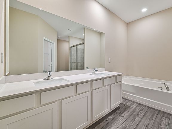 Get ready for your day in the spacious master bathroom