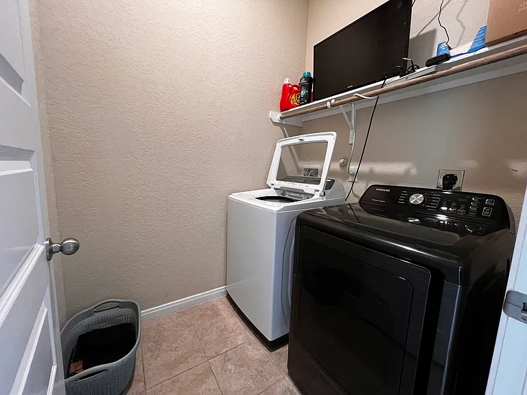 Utility room with new washer and dryer