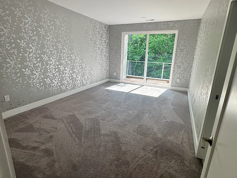Upstairs primary bedroom w private balcony