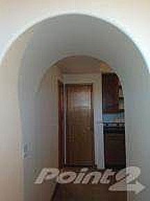Archway to kitchen