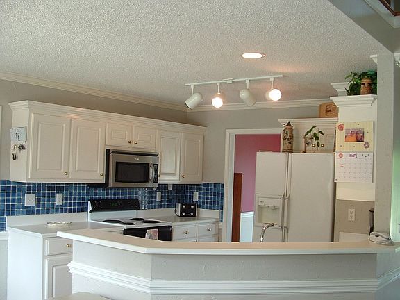 Open kitchen built in microwave, rang, dishwasher, refrigerator