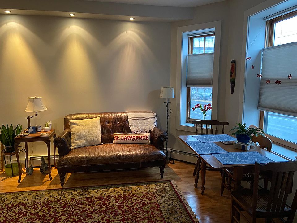 View upon entering the condo - a sitting room with dining table