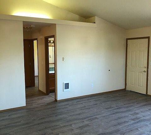 Living room area with vaulted ceilings