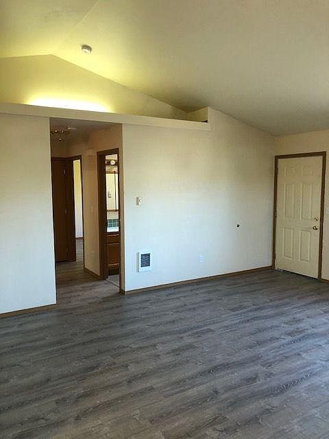 Living room area with vaulted ceilings