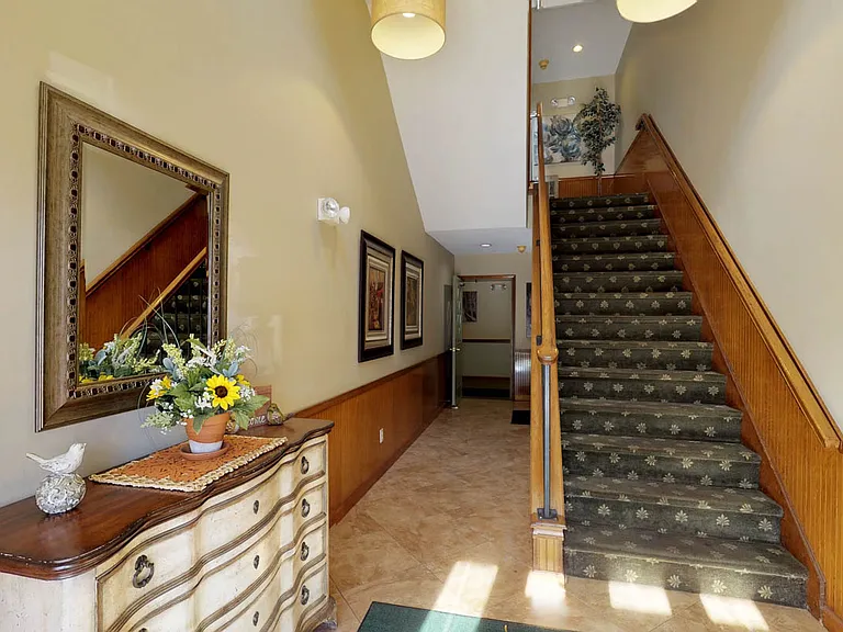 Step into a beautifully appointed and welcoming foyer styled with modern decor.
