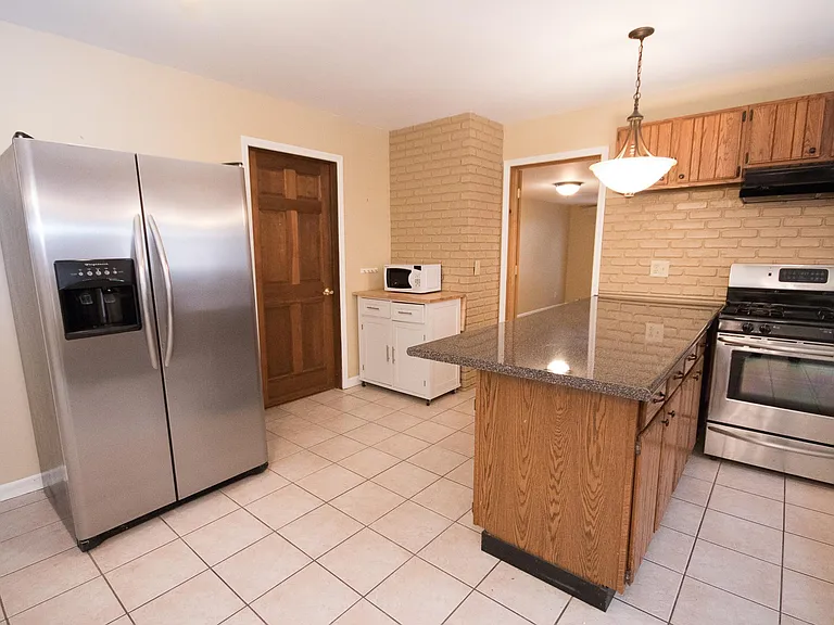 All stainless appliances, garbage disposal, dishwasher, room for your full size dining set