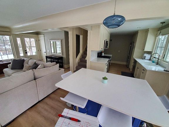 View of island and kitchen , living area.