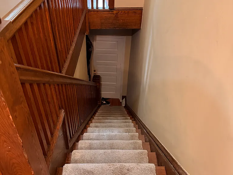 Stairs down to front door.