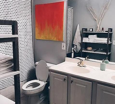 Master bathroom with garden tub and updated fixtures perfectly located at the back of the house with easy access to deck by private entrance.