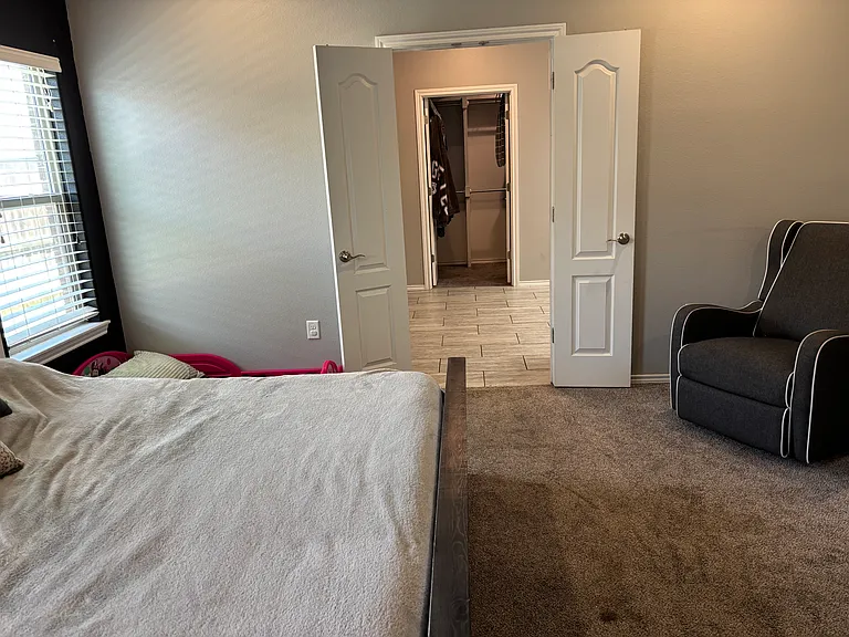Master room looking into restroom and closet