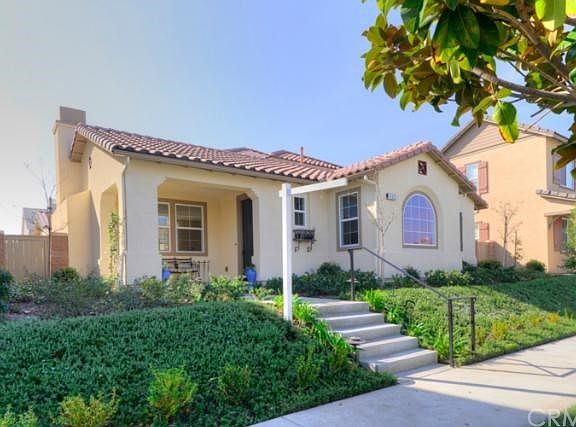 A charming Spanish decor with a welcoming front porch for enjoying the Southern California weather!