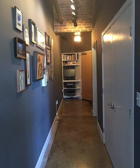 Hallway view of entrance with standing desk