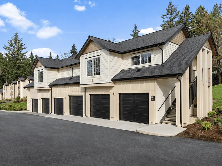 Modern Carriage-style Studio Apartment Building with Private Garages.