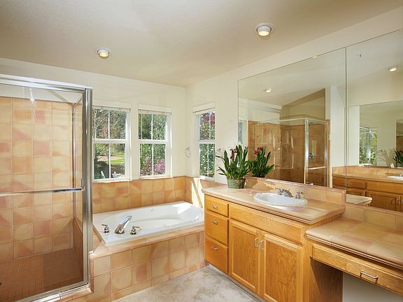 Master bath has tub and separate shower