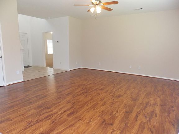 Gorgeous laminate flooring invites you into the home.