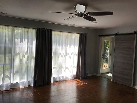 Large windows with view to back yard. Window treatments included
