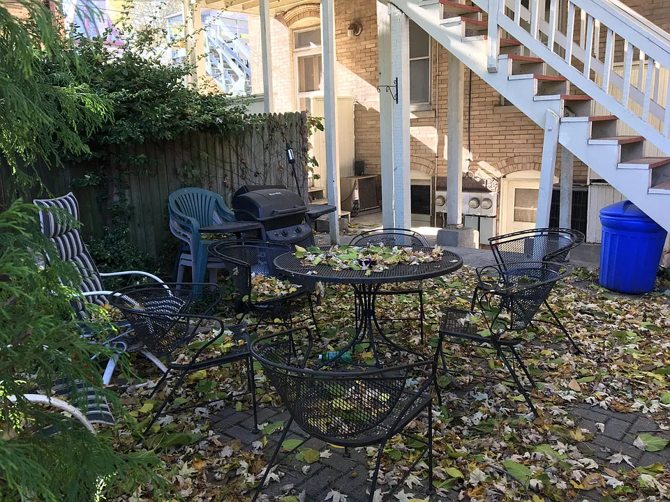 Back patio... note rear entrance to 838 apartment is beyond that fence in the center of the photo.