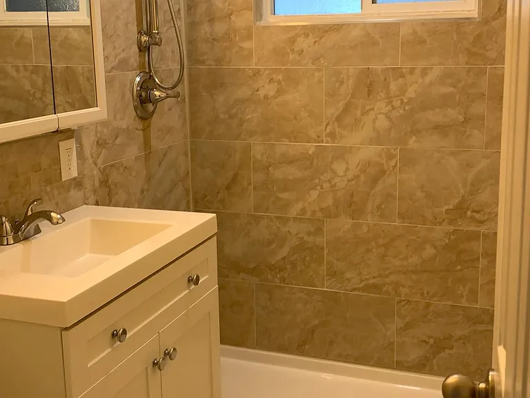 Bathroom sink and shower, upstairs