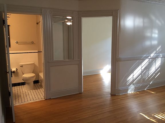 Bedroom view of bath and office