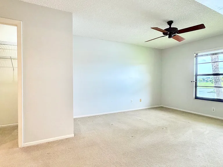Spacious bedroom w/ HUGE walk-in closet + a linen and storage closet!