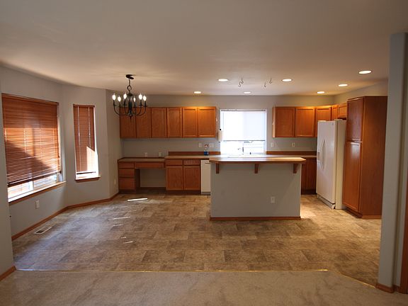 A view of the kitchen from the family room. Note eat-in space on the left for casual meals.