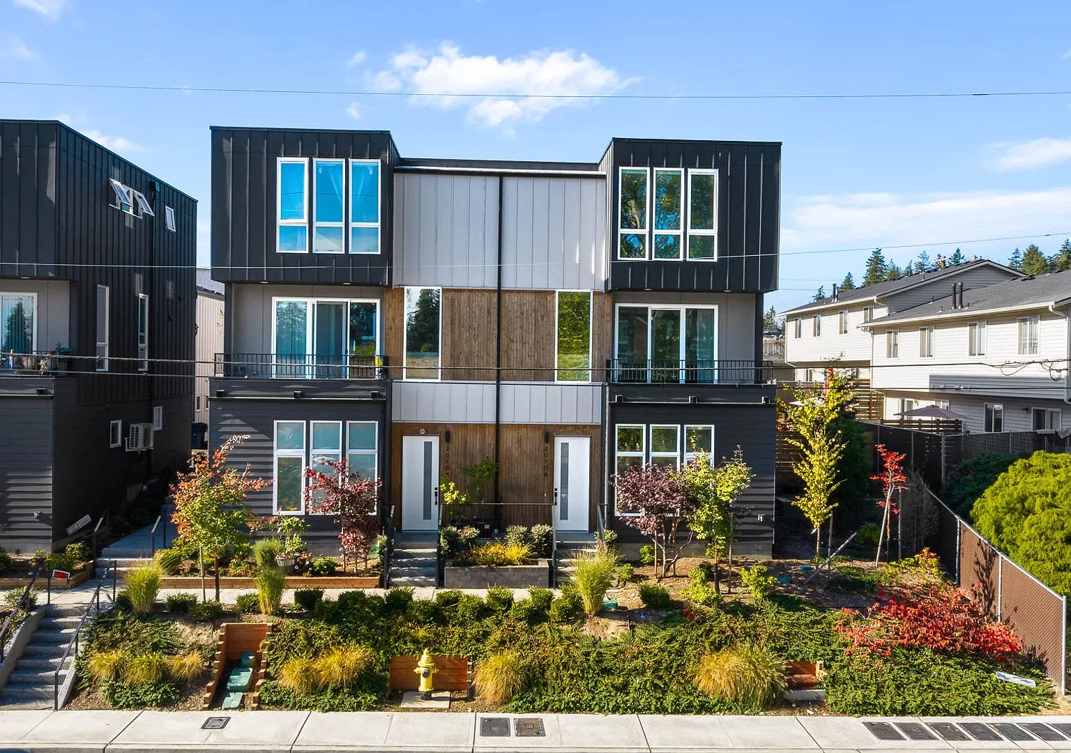 Modern Corner Home with Abundant Natural Light, Spacious Balcony & 2-Car Garage! — Photo 1