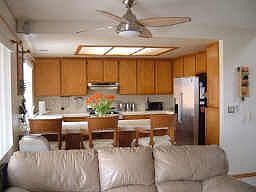 Open kitchen with breakfast bar, all appliances convey