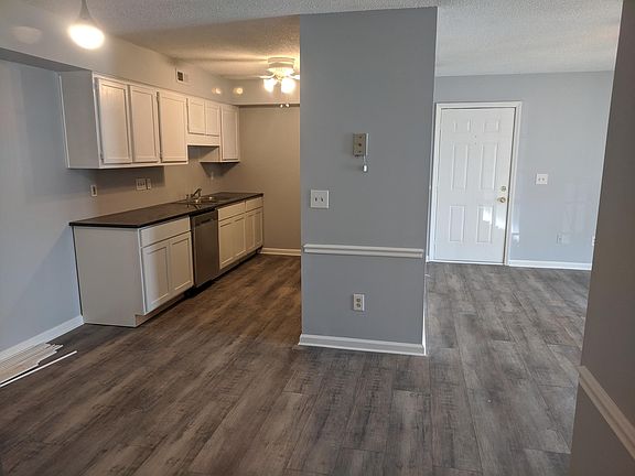 Kitchen open to dining open to living