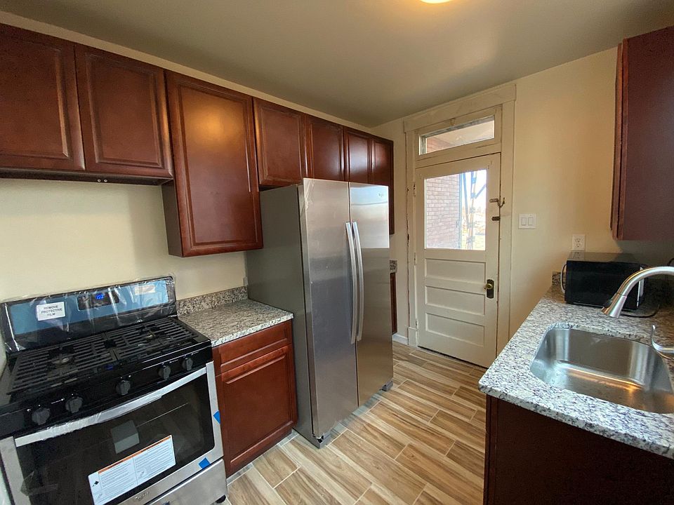 New Kitchen with ceramic flooring, new cabinets, new granite countertops, new stainless steel appliances including a gas range, a refrigerator, and a dishwasher.