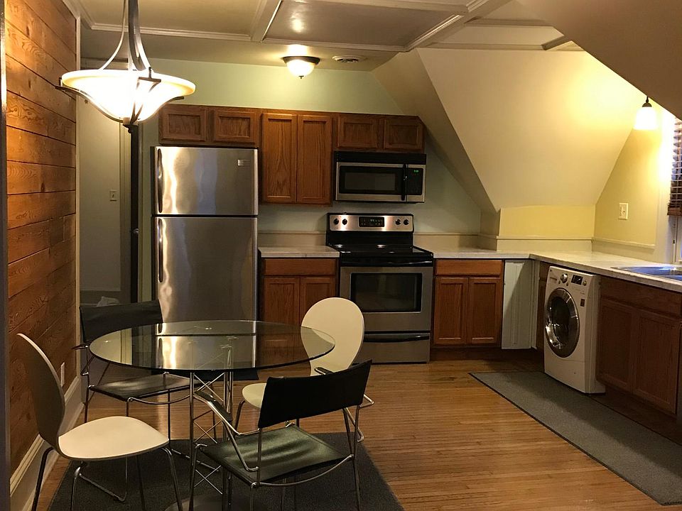 Eat-in kitchen with stainless appliances, wash/dryer combo, dishwasher, microwave, ceramic-top electric stove w/oven