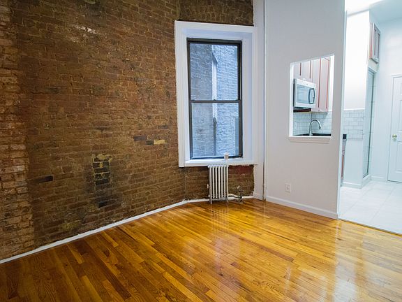5th image of 217 E 10th St APT 3