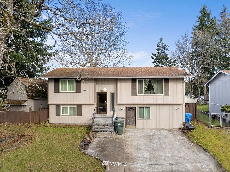 Corner lot home has 2 outbuildings. 