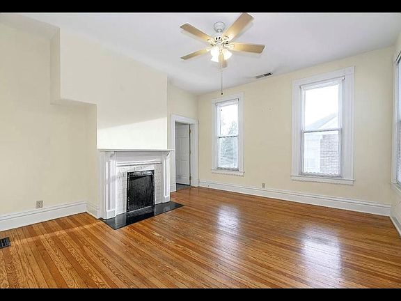 Living Room Area that has a bedroom connected off of it.