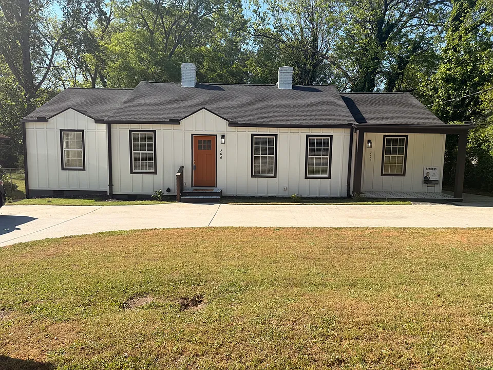 Front of property. Private driveway.