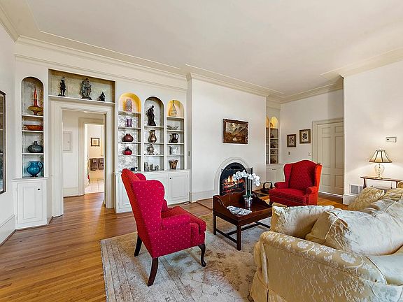 Apartment 2 living room. Entry is the door on the right. Fireplace is decorative.