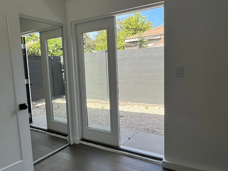 Second bedroom with french doors to patio
