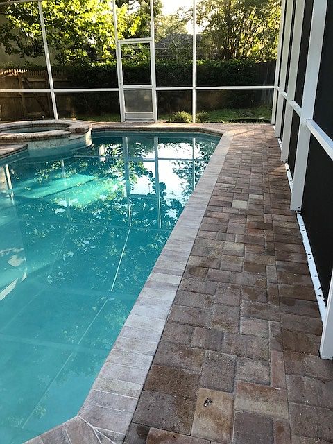 Screened pool with hot tub