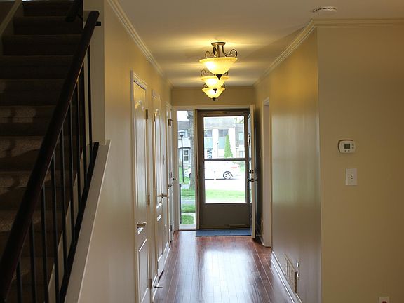 Entry Way with coat closet, pantry and half bathroom