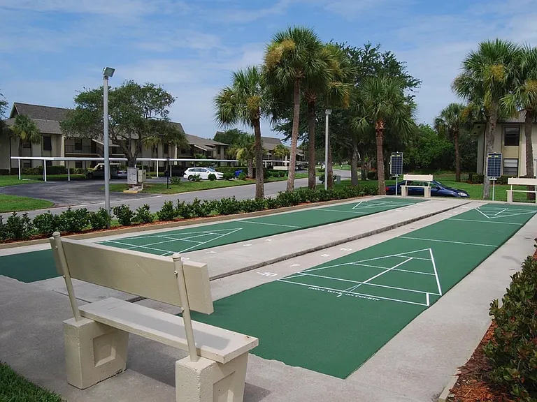 Shuffleboard courts are next to Recreation B pool. Area can be lit at night and poles and discs stored nearby.