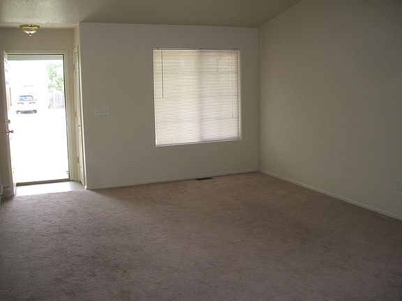 Living room looking to opened front door