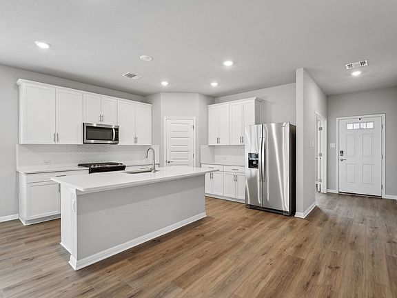 Cook a delicious meal in the beautiful kitchen.